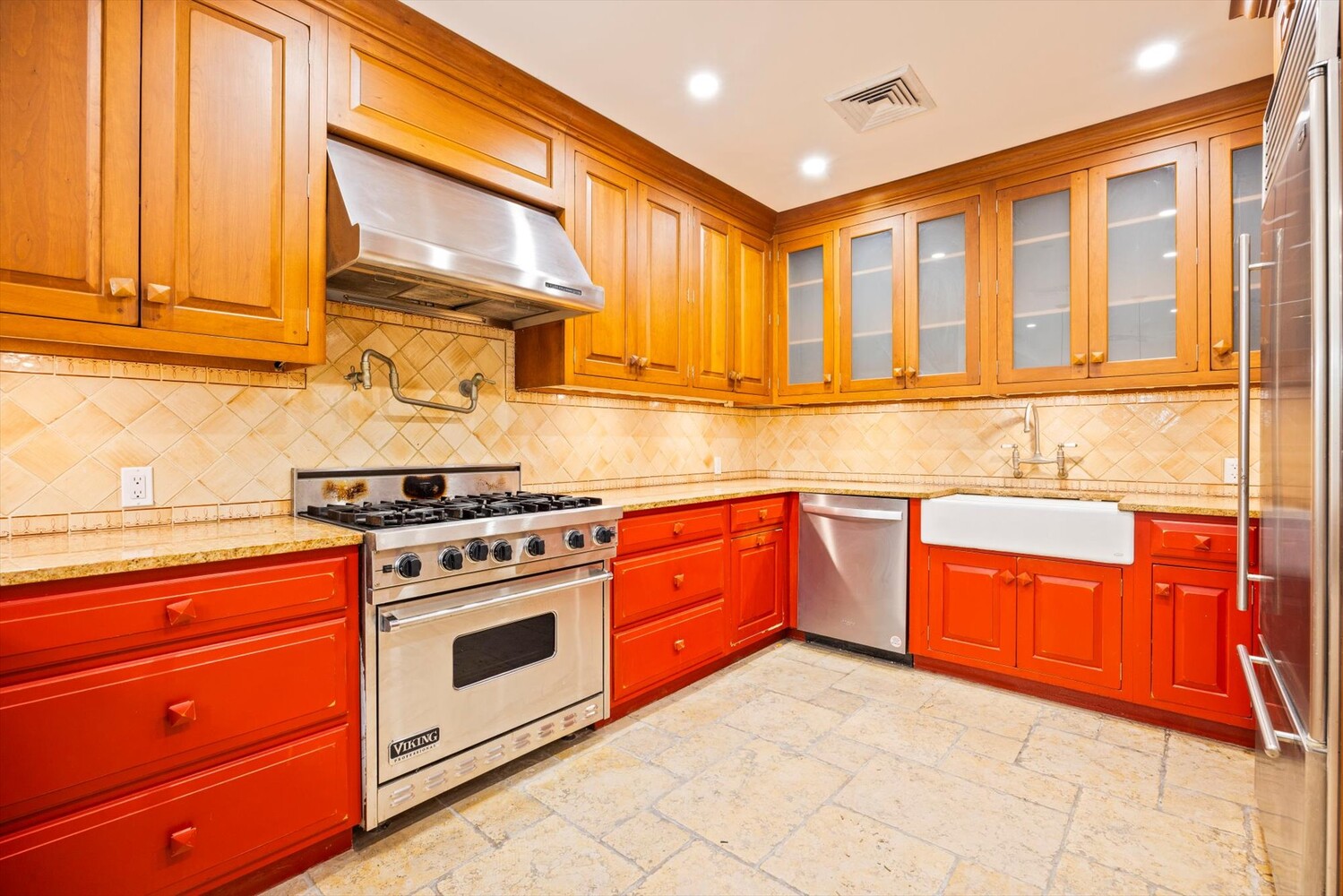 329 Convent Avenue Manhattan, NY 10031 - Photo 9 of 28 a kitchen with stainless steel appliances granite countertop a stove and a sink