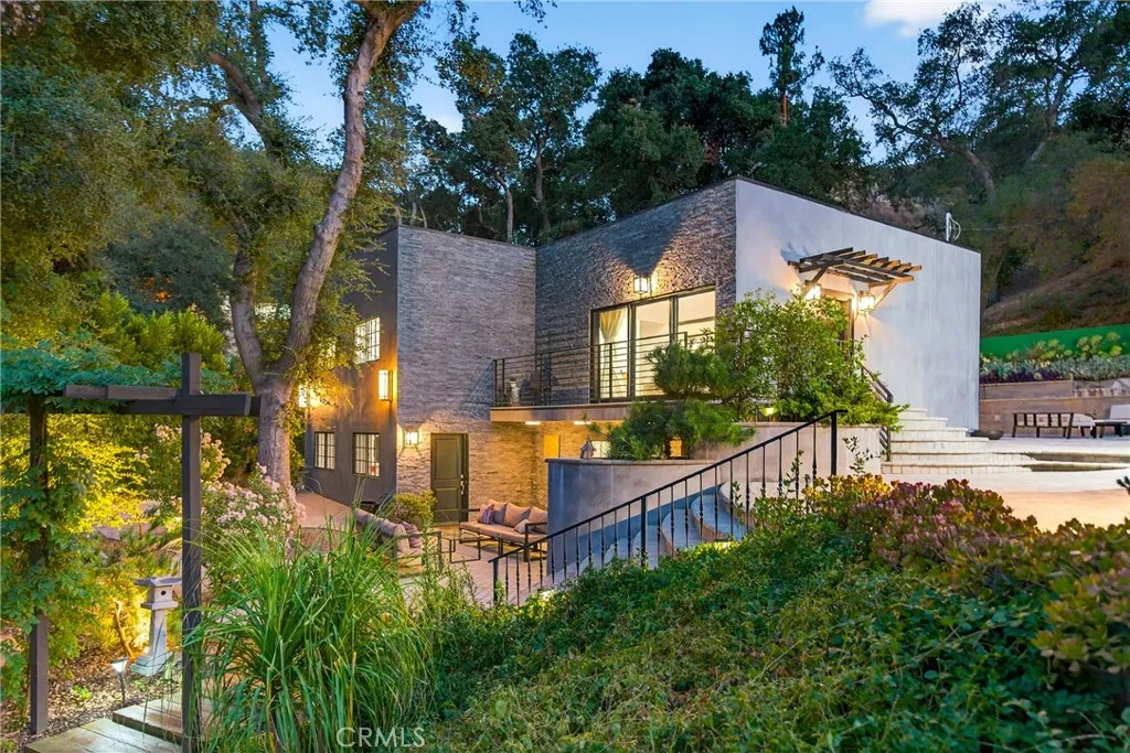 7572 McGroarty Terrace Los Angeles, CA 91042 - Photo 1 of 47 a view of a house with backyard and sitting area