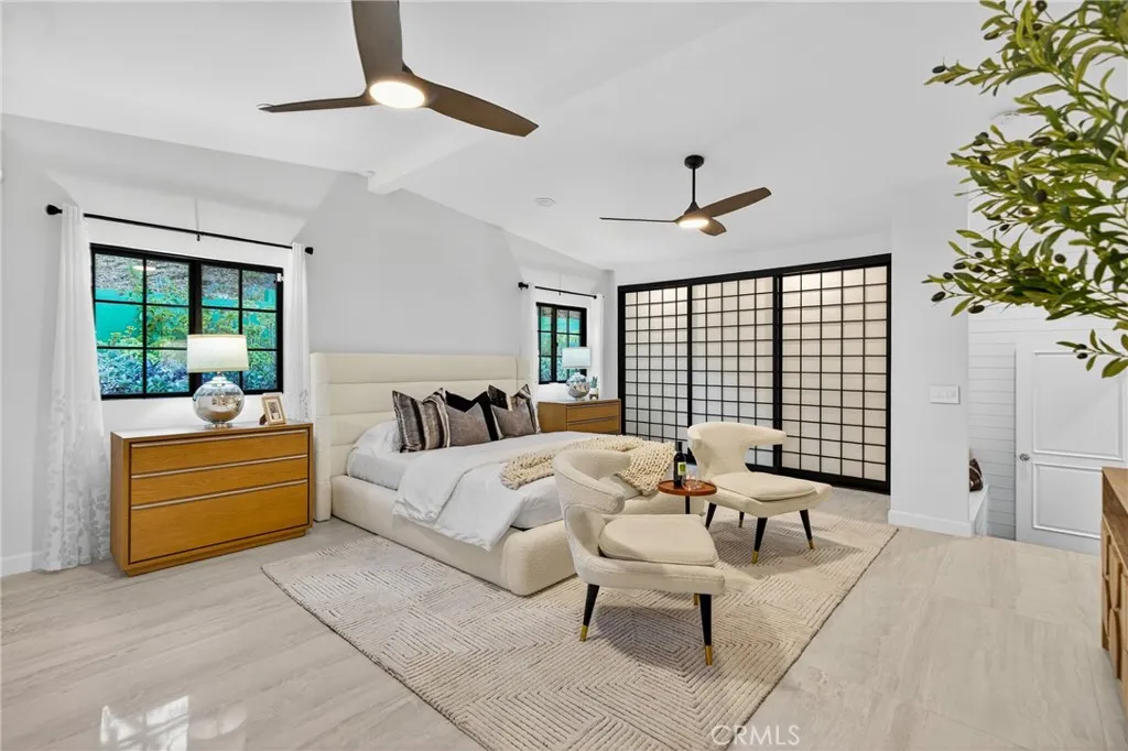 7572 McGroarty Terrace Los Angeles, CA 91042 - Photo 11 of 47 a bed room with a bed and a couch