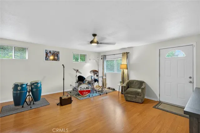 a view of a livingroom with furniture and gym equipment