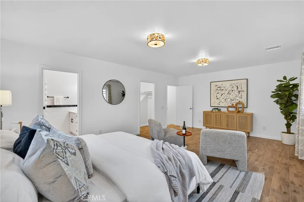 7572 McGroarty Terrace Los Angeles, CA 91042 - Photo 36 of 47 a bedroom with a bed and a couch