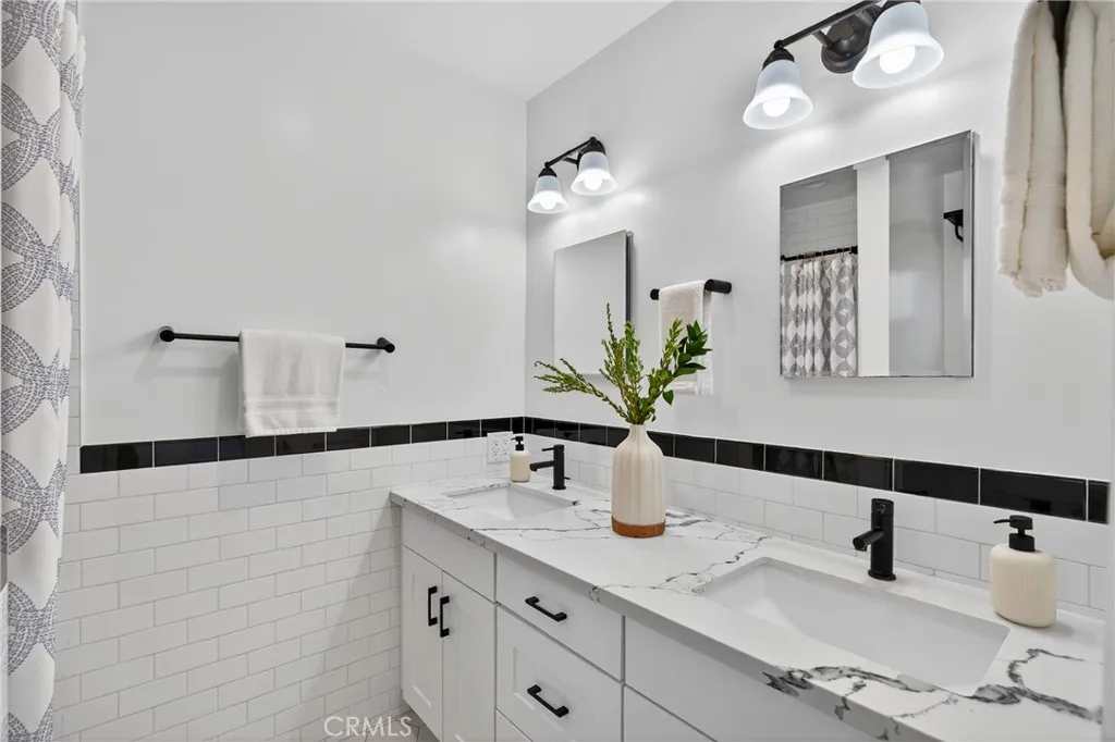 7572 McGroarty Terrace Los Angeles, CA 91042 - Photo 37 of 47 a bathroom with a sink and a mirror