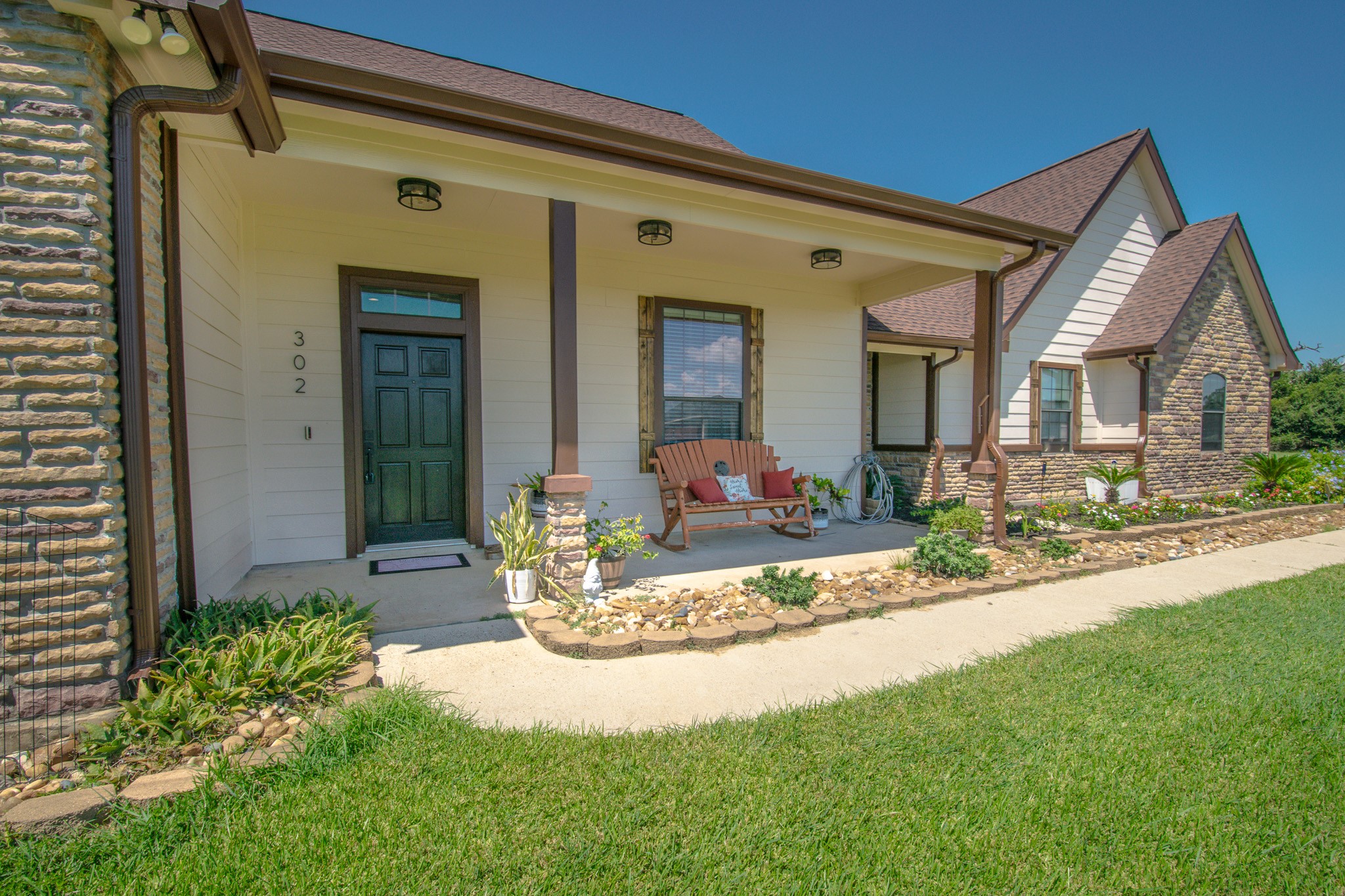 a front view of a house with garden