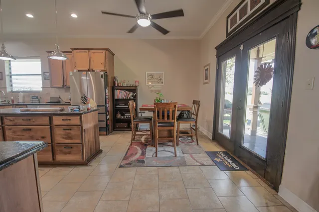 a view of a dining room with furniture and chandelier