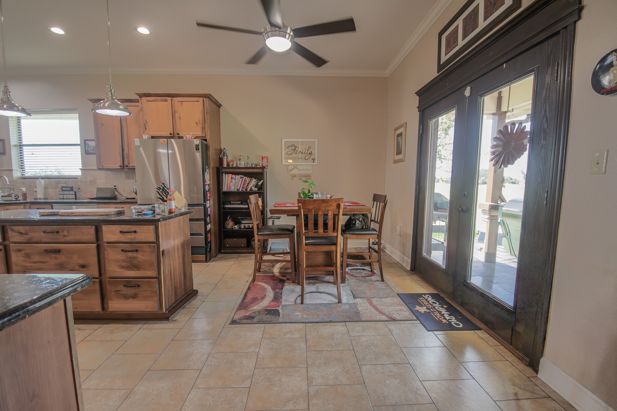 302 Mayad Boulevard Rosharon, TX 77583 - Photo 11 of 42 Look at the additional room you have in the back of the kitchen! French doors lead you to your backyard & covered patio!