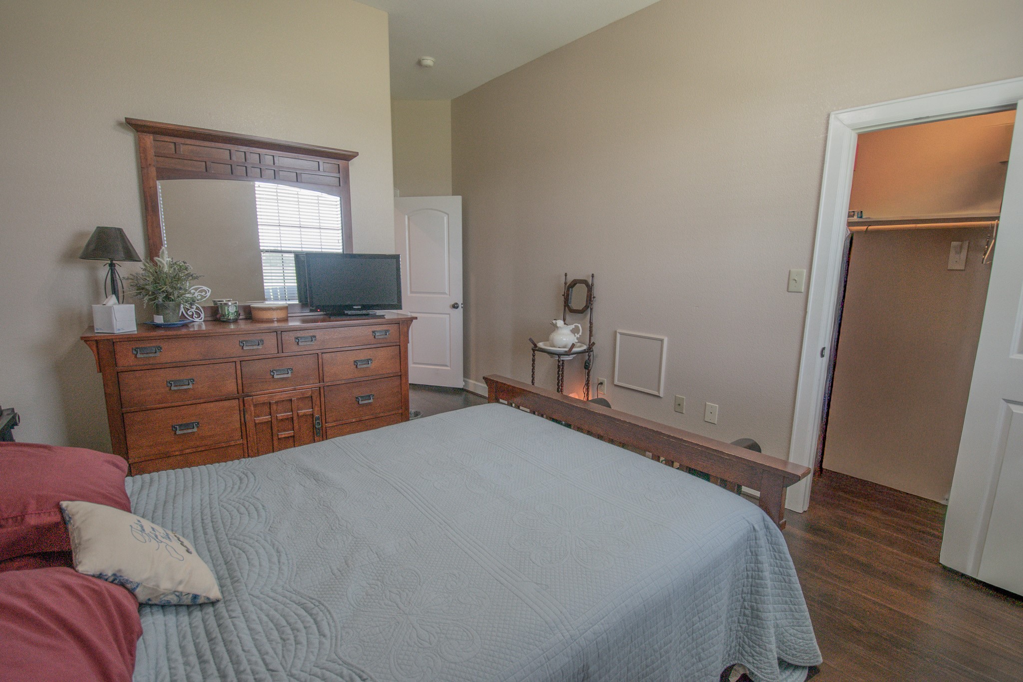 302 Mayad Boulevard Rosharon, TX 77583 - Photo 27 of 42 a bedroom with a bed and a dresser in it