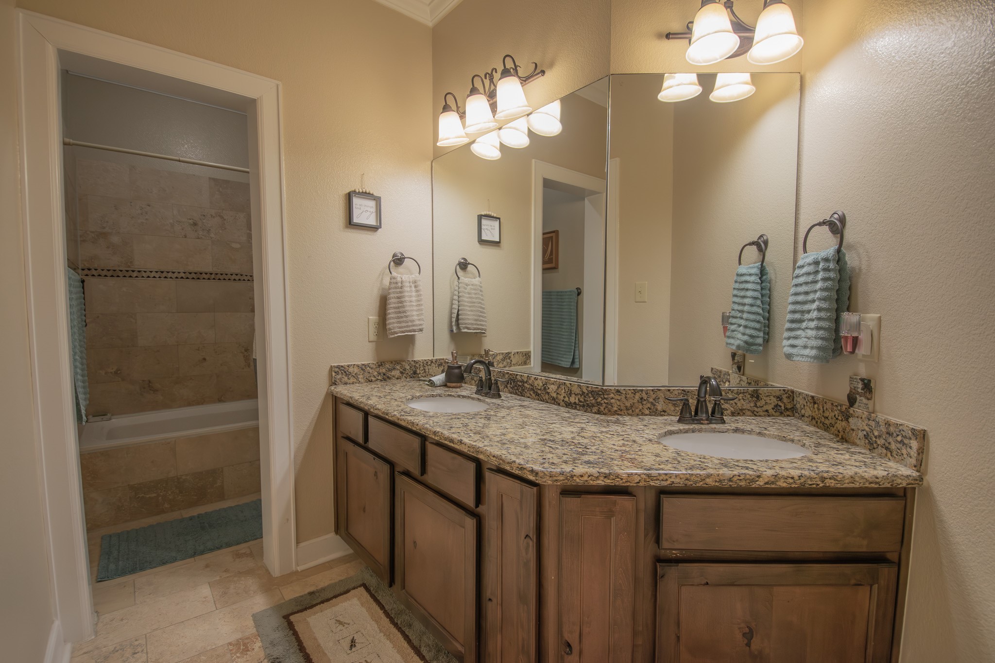 302 Mayad Boulevard Rosharon, TX 77583 - Photo 28 of 42 a bathroom with a granite countertop sink a toilet and a mirror