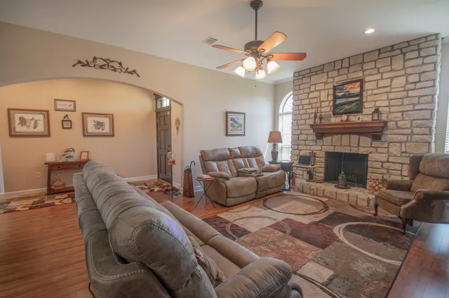 a living room with furniture and a fireplace