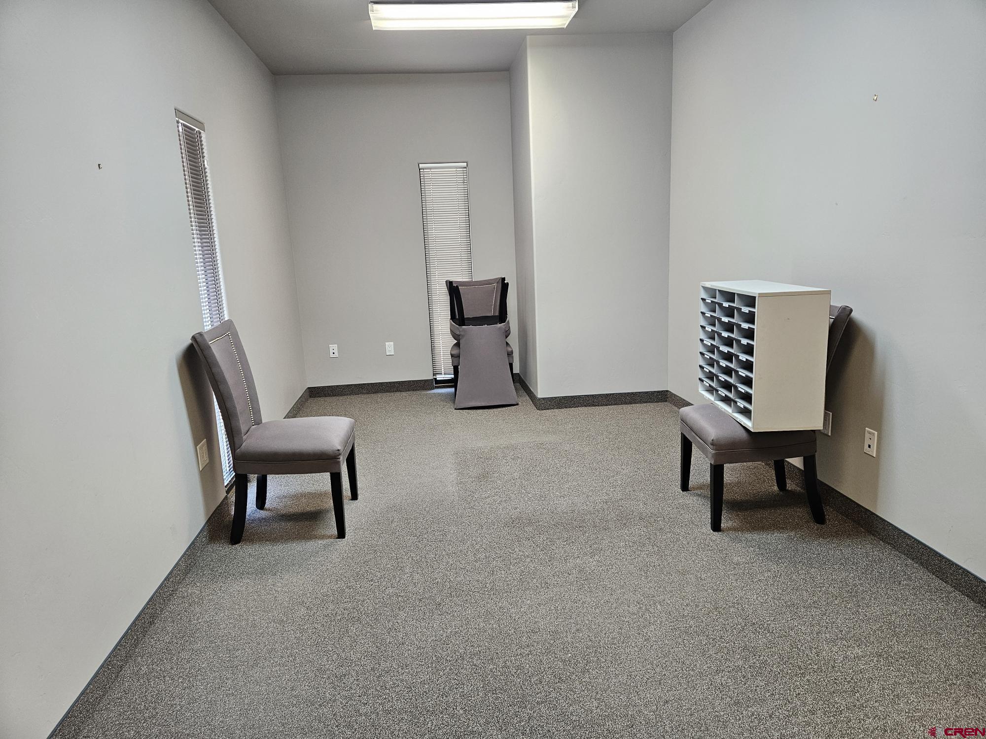 132 East 5th Street, Unit 201 Delta, CO 81416 - Photo 5 of 8 a living room with furniture and a chair