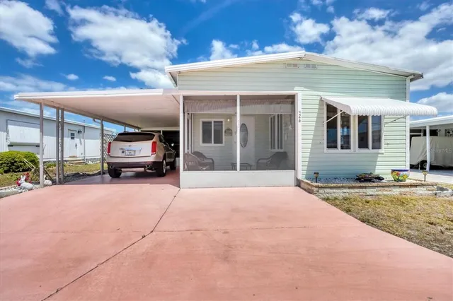 a view of a house with truck parked in front of a building