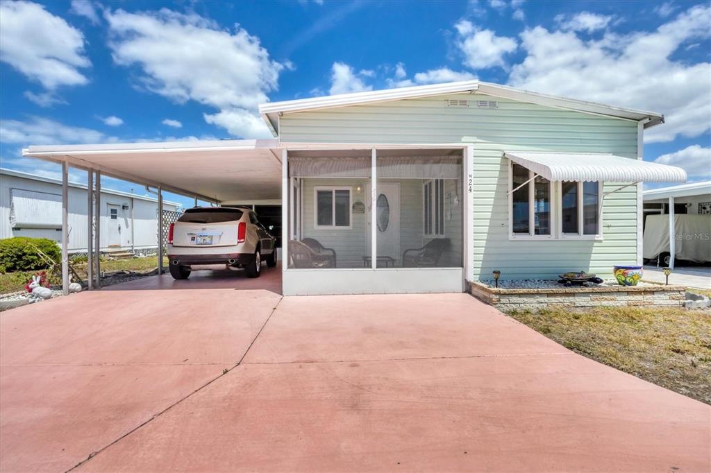 a view of a house with truck parked in front of a building