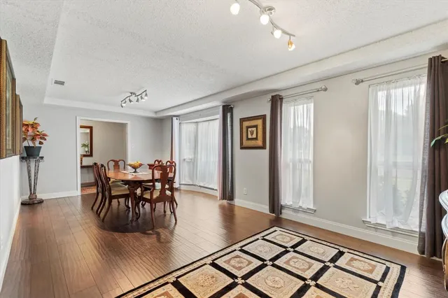 a view of a dining room with furniture and window