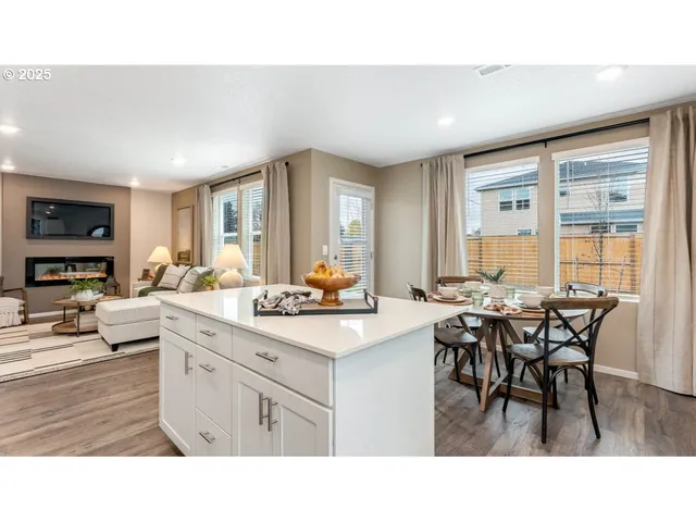 a kitchen with a table and chairs