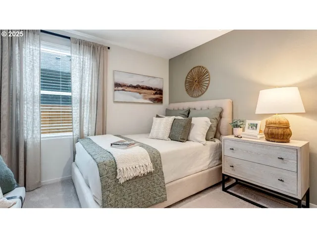 a bed room with a bed and a lamp