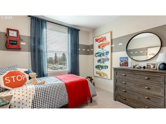 a bedroom with a bed and a dresser