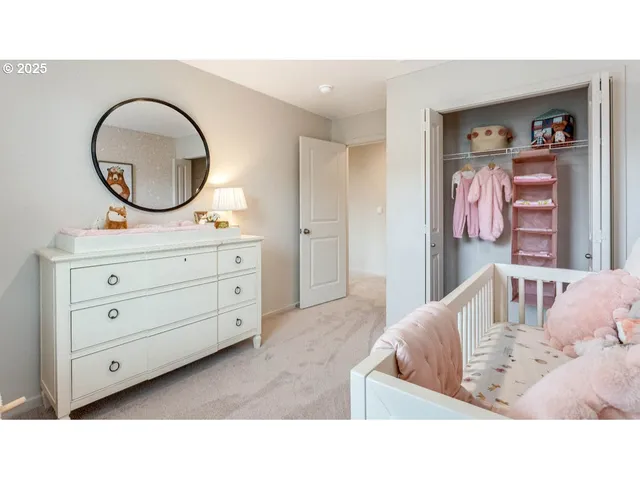 a living room with furniture and a mirror