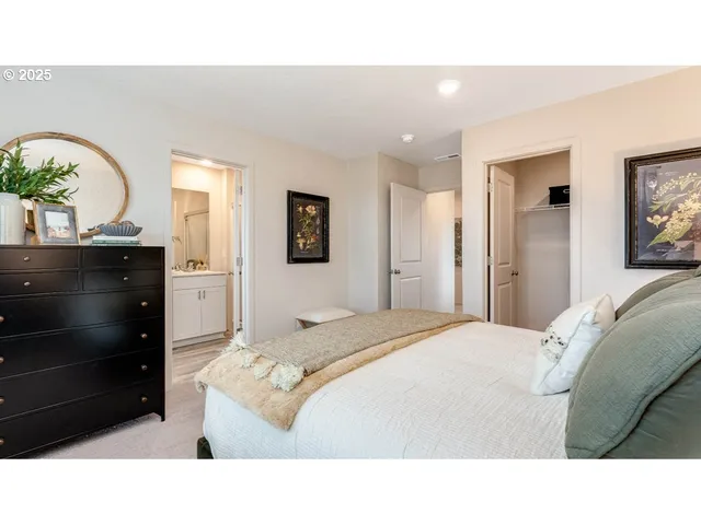 a living room with a bed and furniture