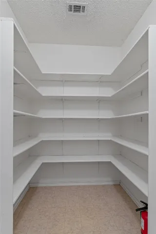 a view of a room with shelves