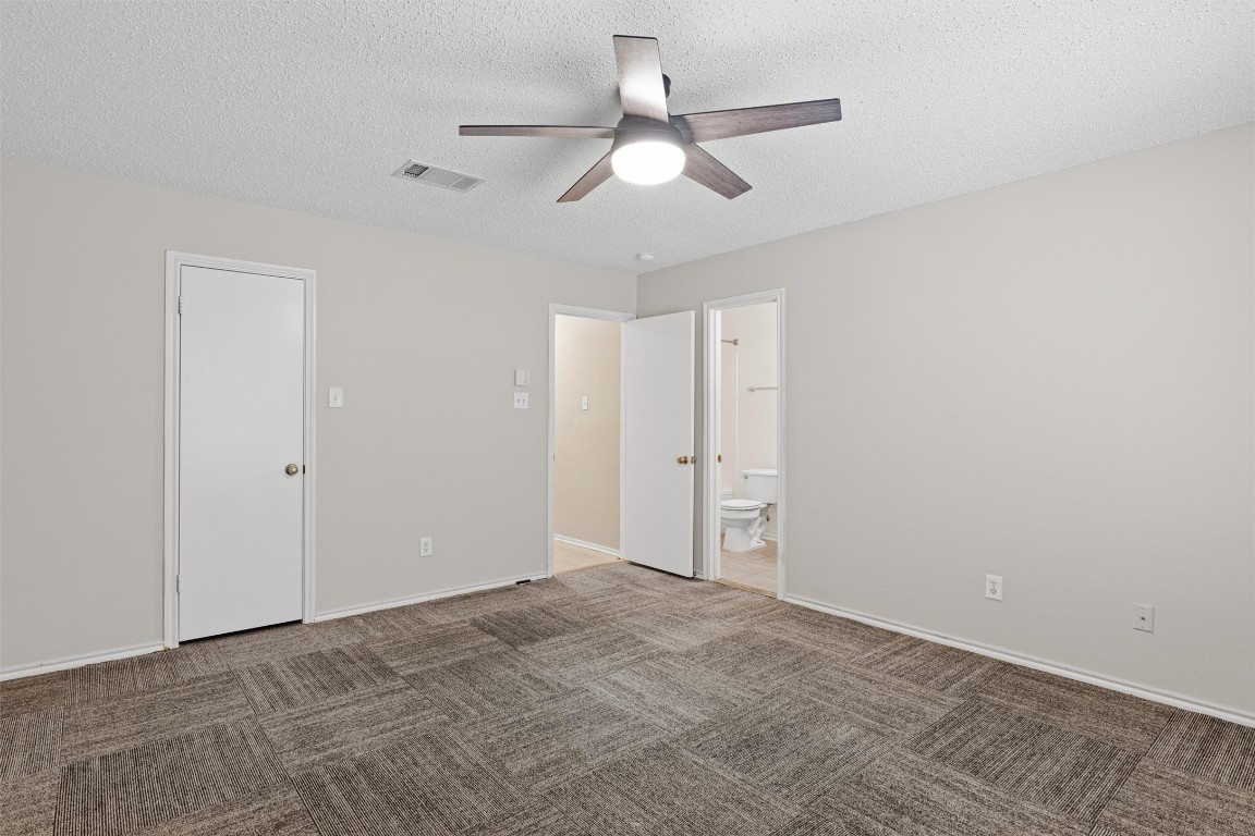 1353 Lakeside Loop Round Rock, TX 78665 - Photo 16 of 29 a view of an empty room and chandelier fan
