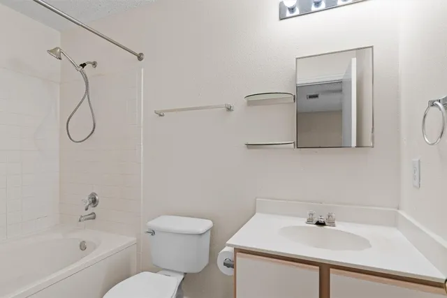 a bathroom with a sink a toilet and a bathtub