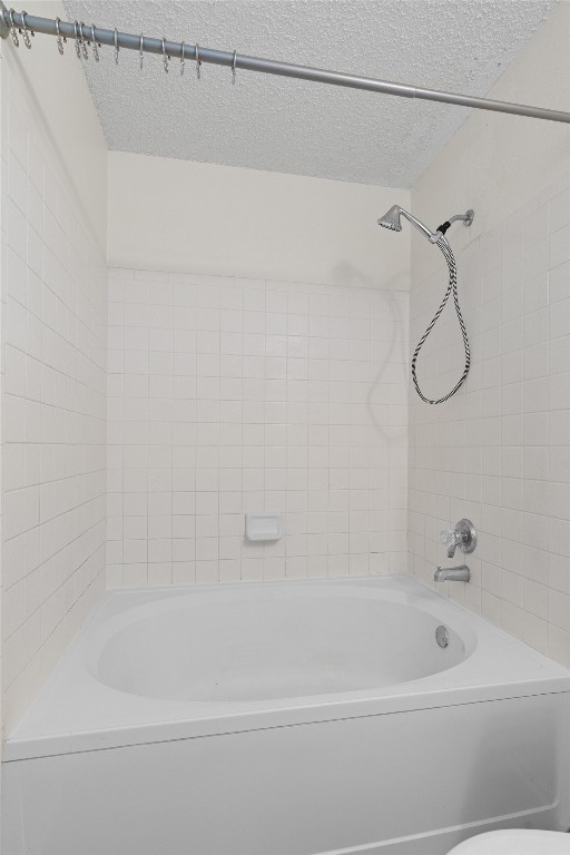 1353 Lakeside Loop Round Rock, TX 78665 - Photo 19 of 29 a bathroom with a bath tub and a shower