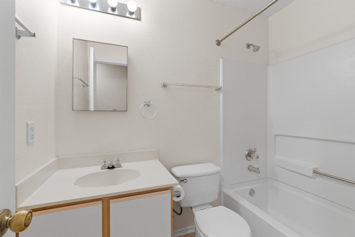 1353 Lakeside Loop Round Rock, TX 78665 - Photo 21 of 29 a bathroom with a sink toilet and vanity