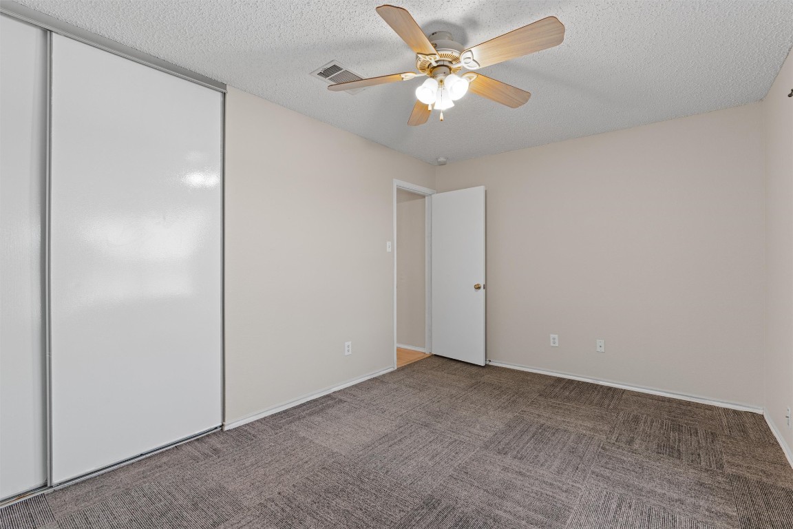 1353 Lakeside Loop Round Rock, TX 78665 - Photo 22 of 29 an empty room with closet and a ceiling fan