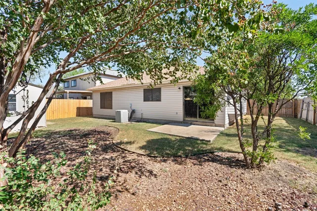 a house with a tree in front of it