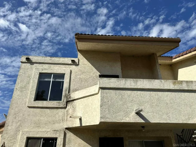 a front view of a house with roof