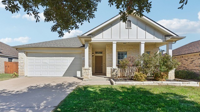 204 Hummingbird Lane Leander, TX 78641 - Photo 1 of 1 a front view of a house with a yard and garage