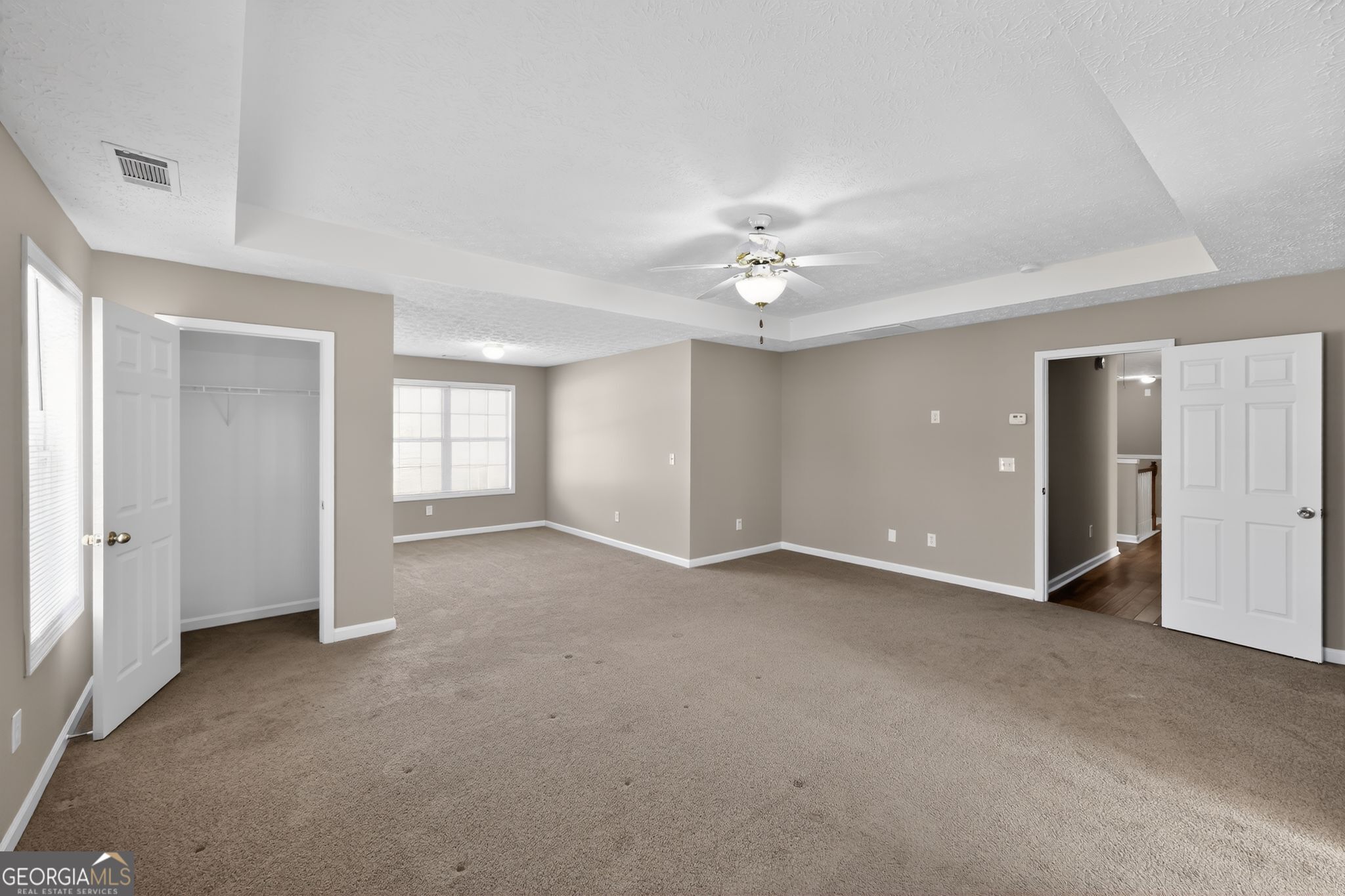 15 Parc Lane Covington, GA 30016 - Photo 19 of 30 a view of an empty room with a ceiling fan