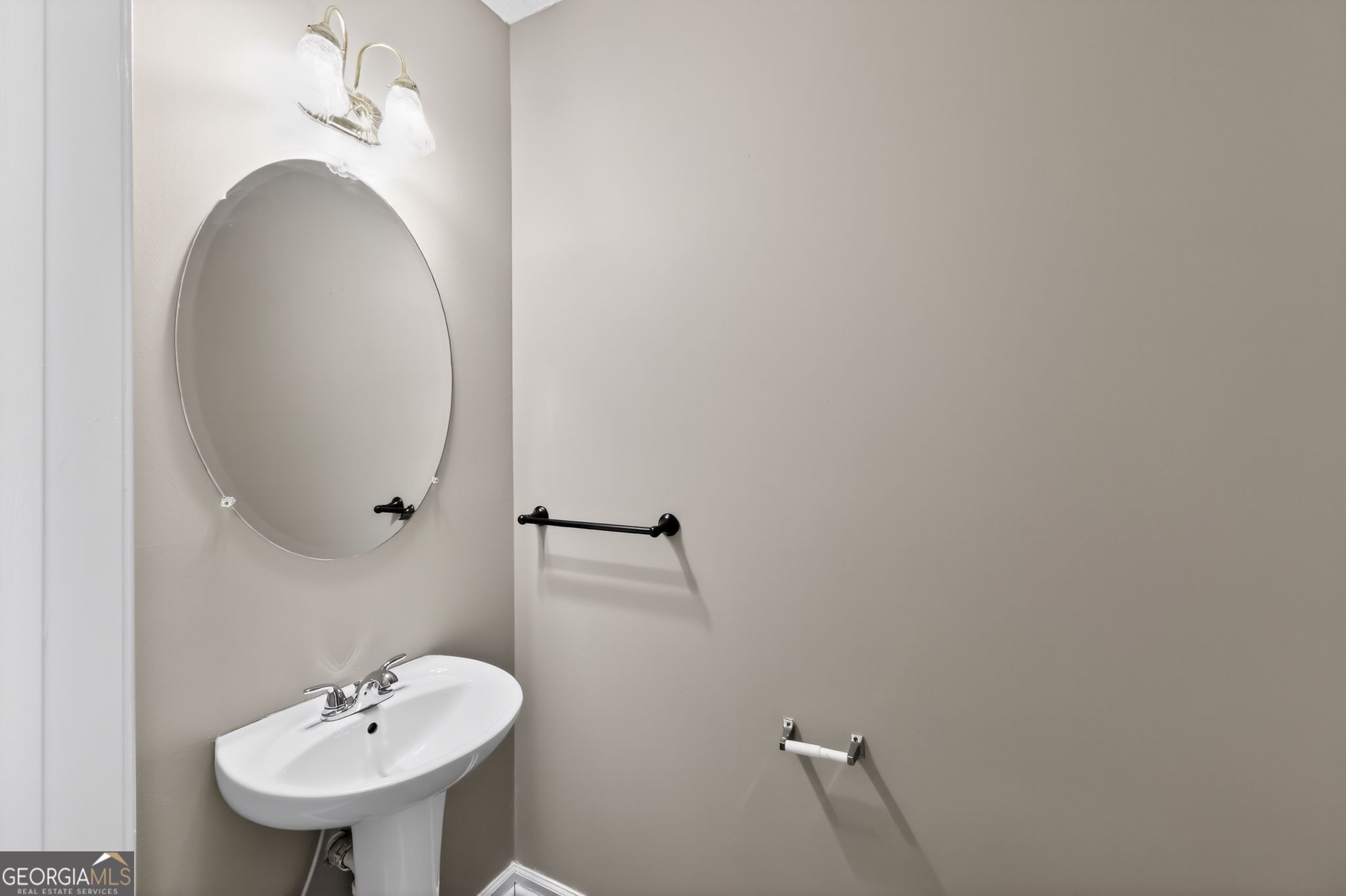 15 Parc Lane Covington, GA 30016 - Photo 20 of 30 a bathroom with a sink and a mirror