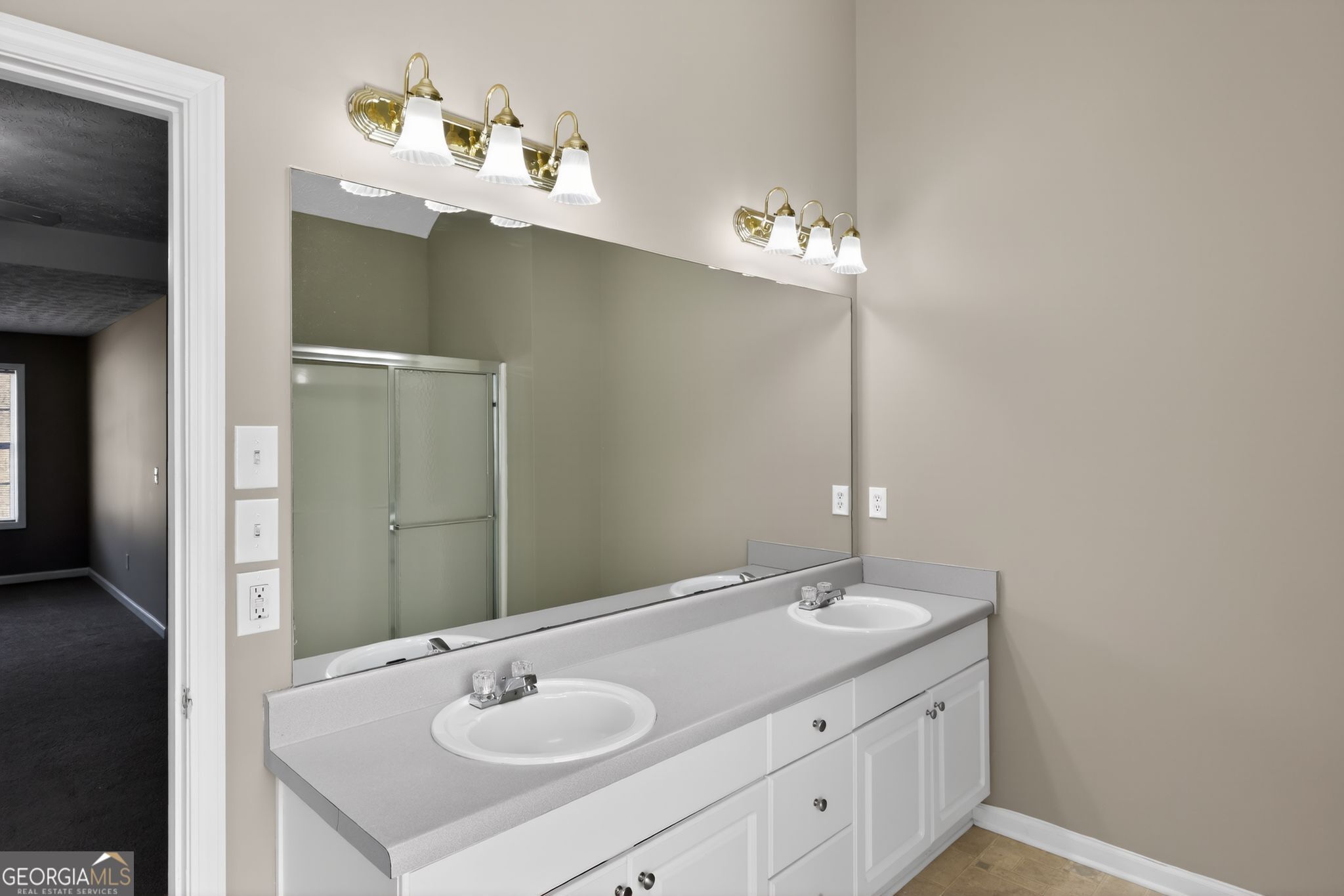 15 Parc Lane Covington, GA 30016 - Photo 21 of 30 a bathroom with a sink and a mirror