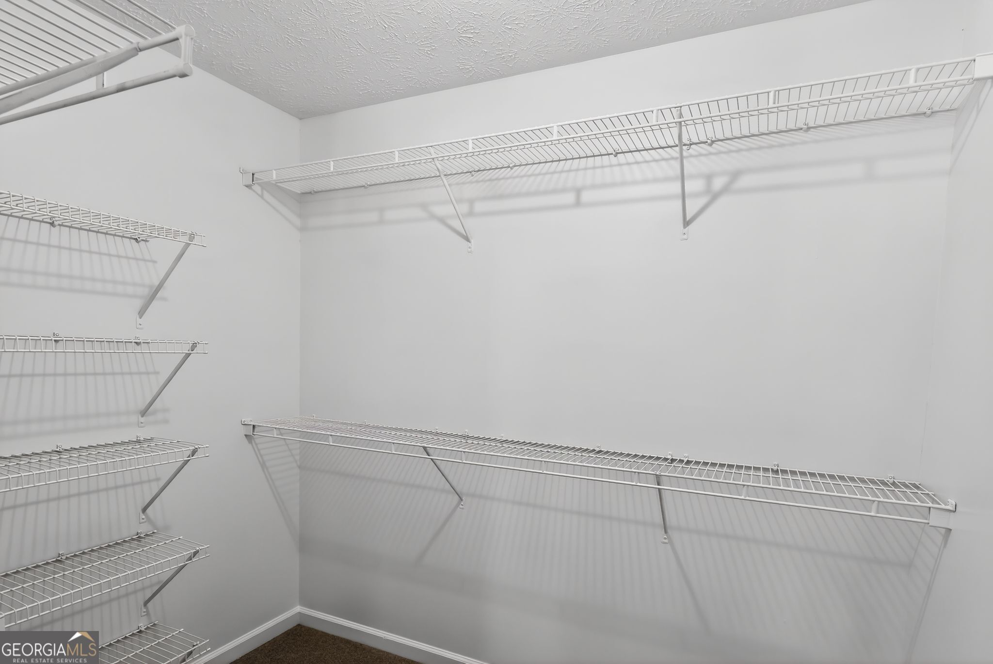 15 Parc Lane Covington, GA 30016 - Photo 27 of 30 a view of a room with racks on the wall