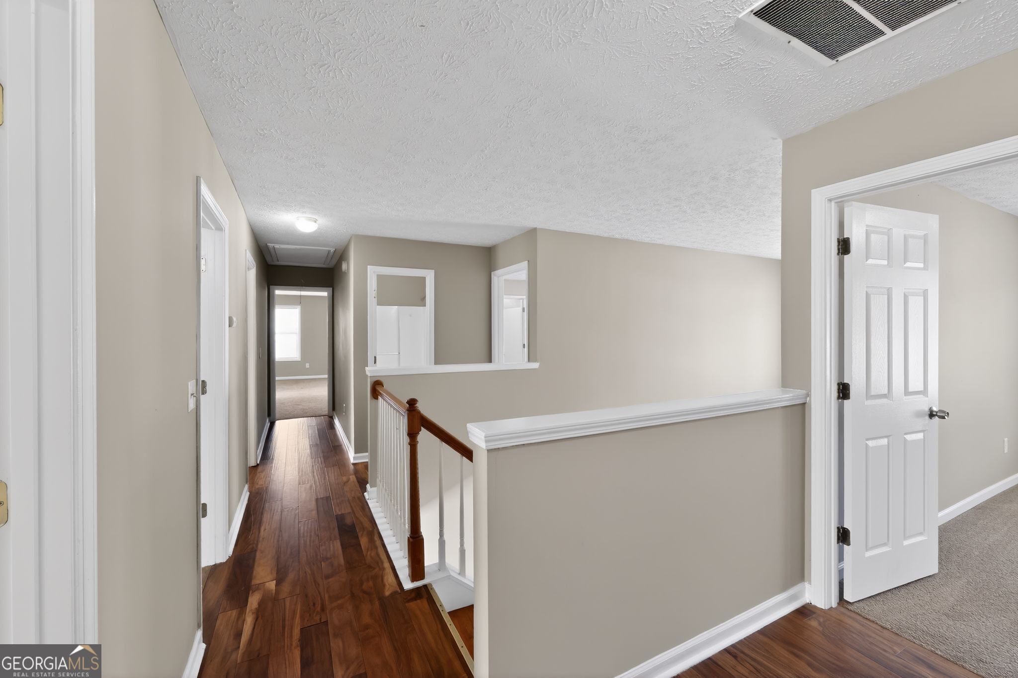 15 Parc Lane Covington, GA 30016 - Photo 28 of 30 a view of a hallway with wooden floor and entryway