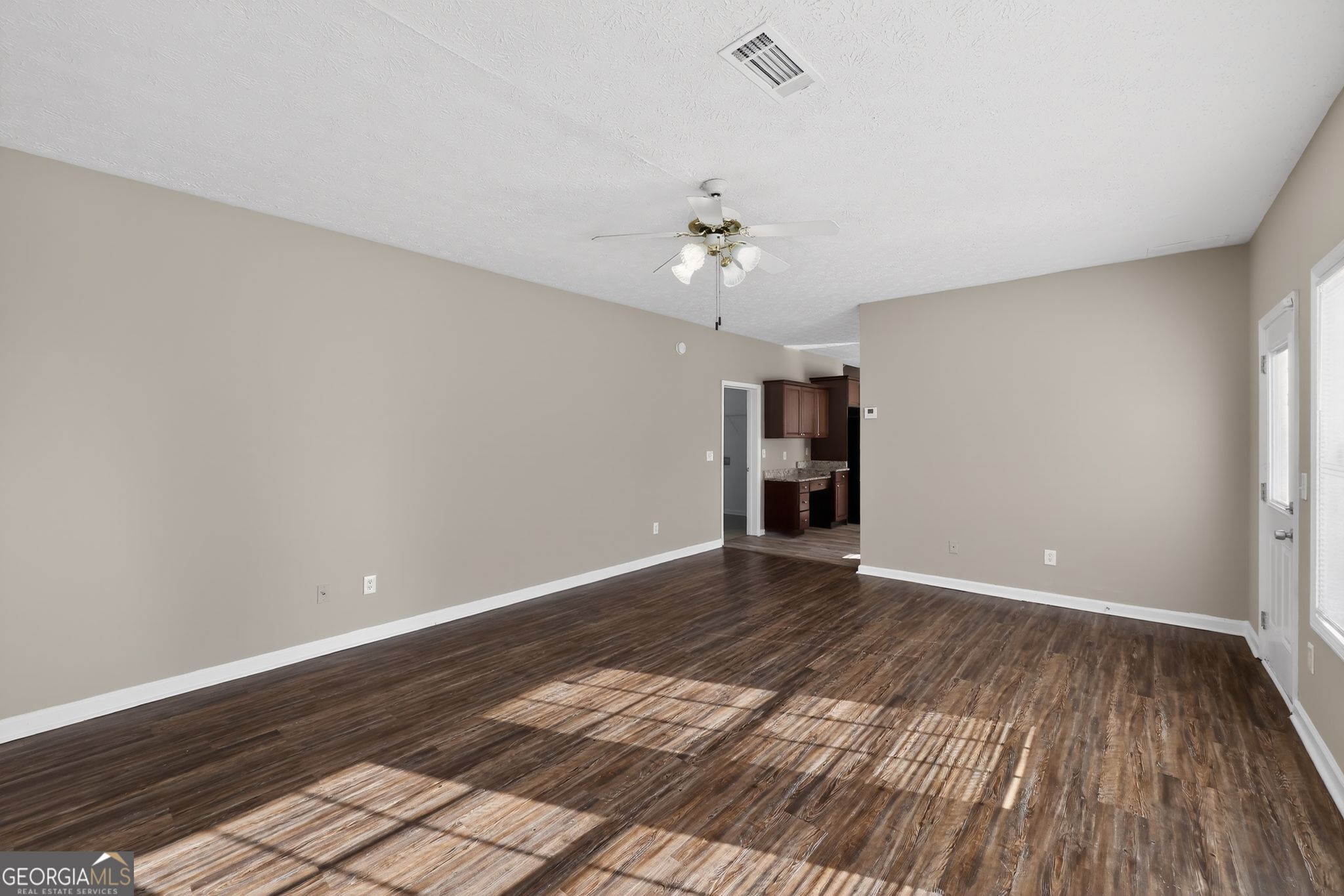 15 Parc Lane Covington, GA 30016 - Photo 3 of 30 wooden floor in an empty room with a window