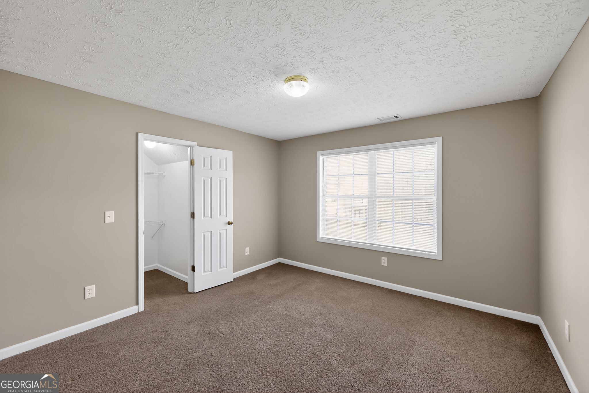 15 Parc Lane Covington, GA 30016 - Photo 10 of 30 an empty room with a empty space and windows