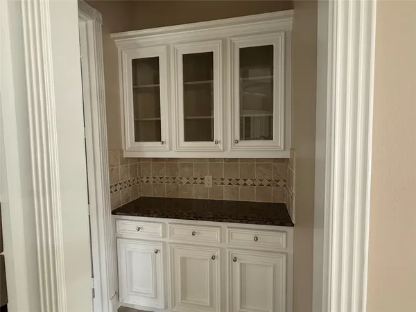a kitchen with a sink and cabinets