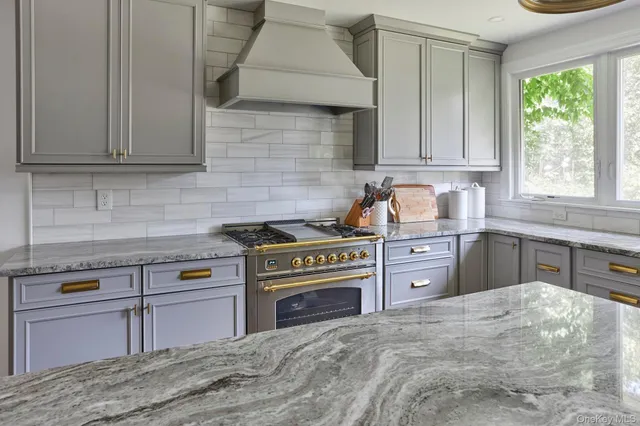 a bathroom with a sink and mirror with toilet