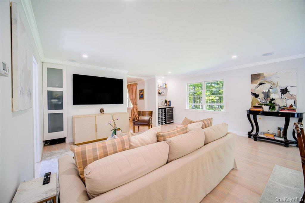 78 Schultz Hill Road Staatsburg, NY 12580 - Photo 25 of 50 Living area featuring crown molding, light wood-type flooring, and recessed lighting