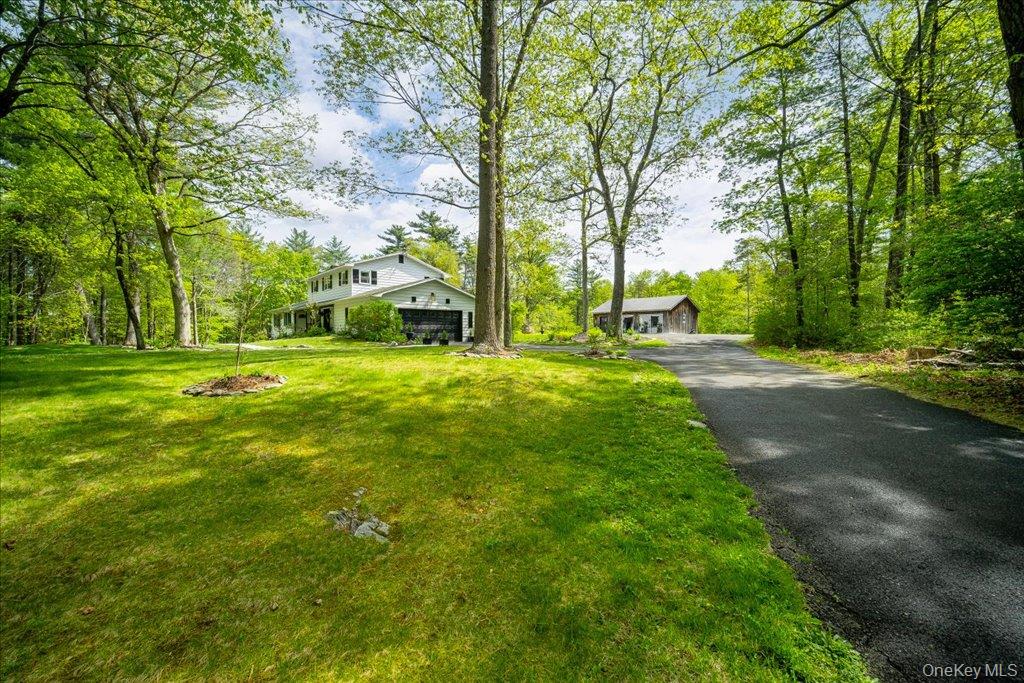 78 Schultz Hill Road Staatsburg, NY 12580 - Photo 3 of 50 View of front of home with a front yard, asphalt driveway, and a garage