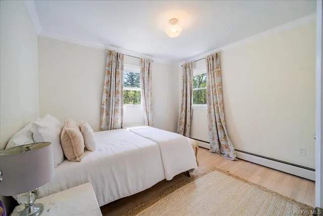 a view of a bedroom with washer and dryer