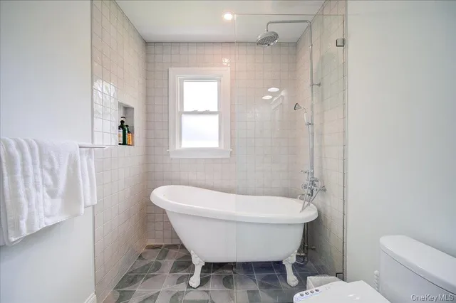 a view of a kitchen with a sink and a large mirror