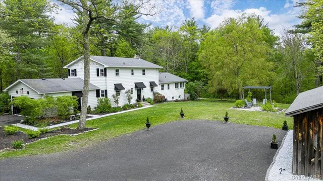 aerial view of a house with a yard