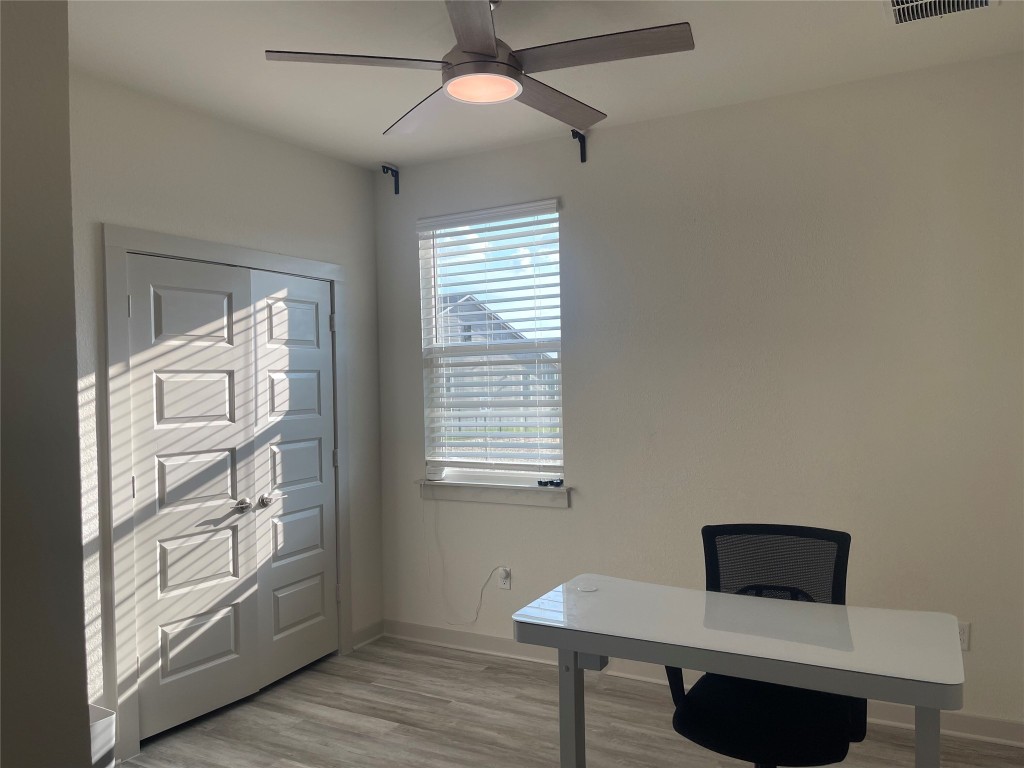 145 Merrick Road Georgetown, TX 78628 - Photo 11 of 33 a workspace with furniture and window