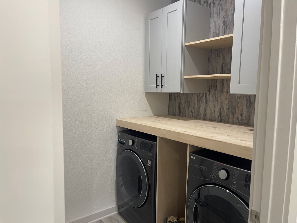 145 Merrick Road Georgetown, TX 78628 - Photo 13 of 33 a utility room with dryer and washer
