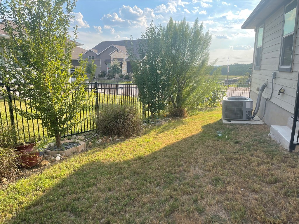 145 Merrick Road Georgetown, TX 78628 - Photo 20 of 33 a view of a yard in front of a building