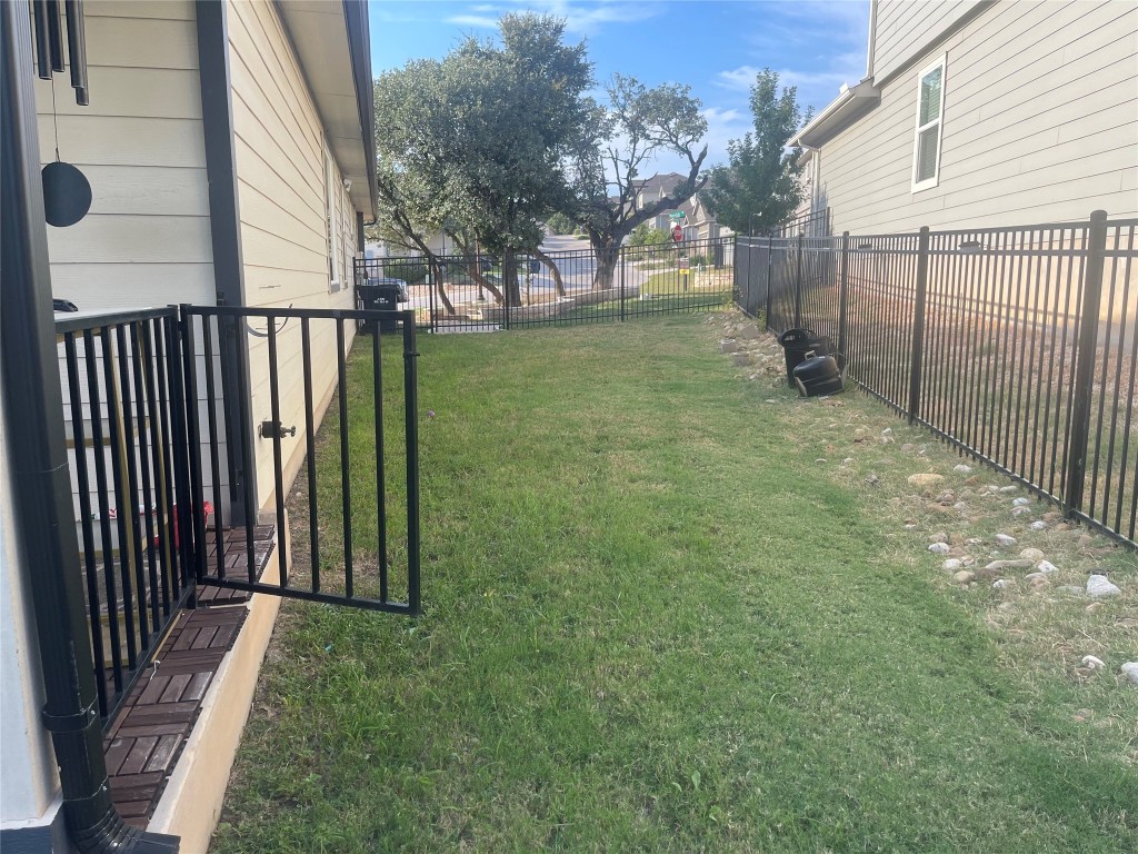 145 Merrick Road Georgetown, TX 78628 - Photo 21 of 33 a view of a backyard with a garden