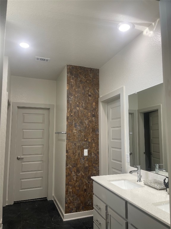 145 Merrick Road Georgetown, TX 78628 - Photo 25 of 33 a bathroom with a sink and a mirror