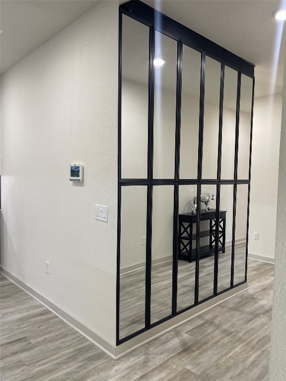 145 Merrick Road Georgetown, TX 78628 - Photo 31 of 33 a view of a hallway with wooden floor and staircase